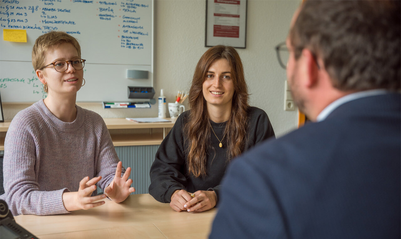 Two young women in an interview